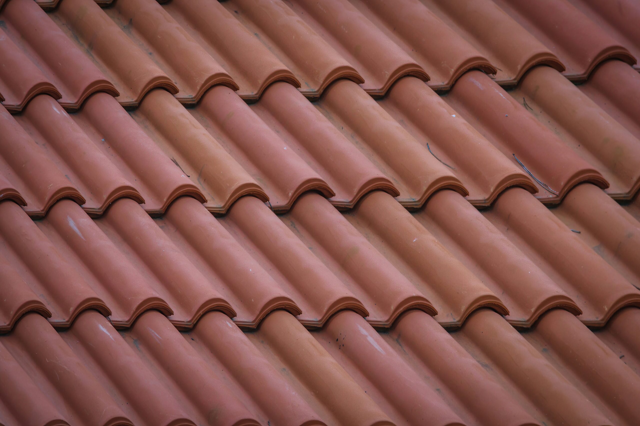 Close-up of red commercial roofing tiles and durable roofing materials
